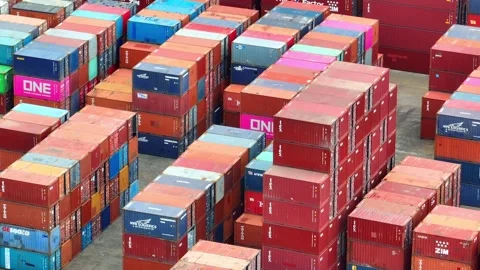 Container yard: An organized expanse of stacked shipping containers. Stock Footage 249728337