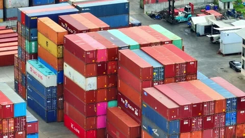 Container yard: A sprawling network of stacked shipping containers. Stock Footage 249728188