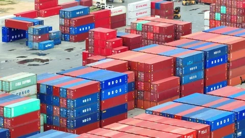 Container yard: A sprawling network of stacked shipping containers. Stockbeeldmateriaal 249728482