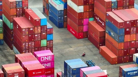 Container yard: Vast expanse of stacked shipping containers. Video stock 249728370