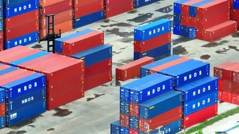 Container yard: Vast expanse of stacked shipping containers. Stockbeeldmateriaal 249728595
