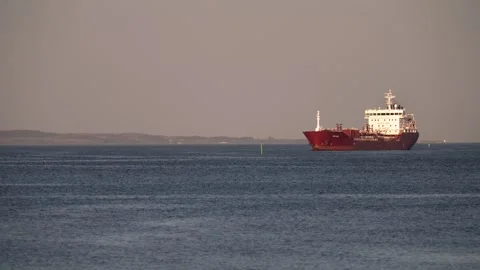 A containerized cargo ship enters the port for unloading Video stock 247272583