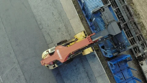 Containers are being lifted on to a block train by means of a transtainer Stock Footage 101228804