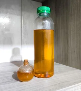Containers with bee honey Stock Photos