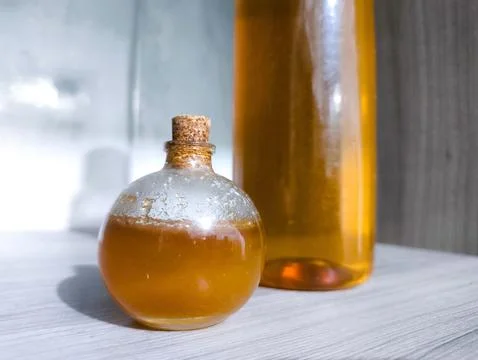 Containers with bee honey Stock Photos