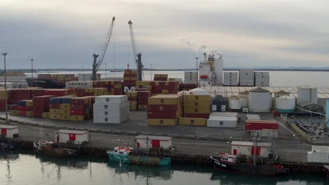 Containers being unloaded at the dock drone aerial in 4k Stock Footage 155418085