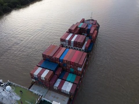 Containers cargo ship on the river Stock Photos
