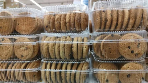 Containers with cookies on the store shelf Stock Footage 170857442