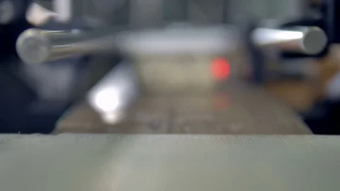 Containers with curd get focused before being taken from a conveyor belt. Video stock 80598615