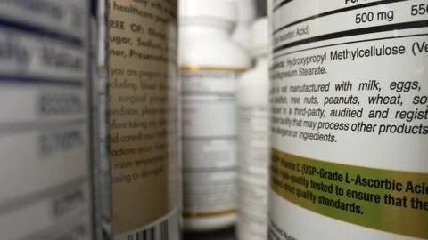 Containers of Dietary Supplements. Plastic Cans for Tablets, Fish oil, Omega 3 Stock Footage 195204674