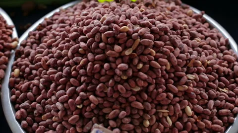 Containers with different kinds of nuts cashews, hazelnuts, peanuts on the Vidéo 63426416