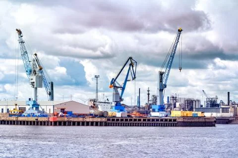 Containers, docks and cranes in the port of hamburg Stock Photos
