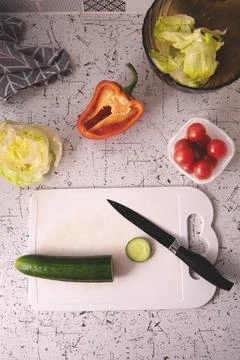 Containers with fresh vegetables on a yellow background Stock Photos