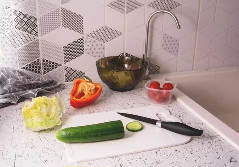 Containers with fresh vegetables on a yellow background Stock Photos