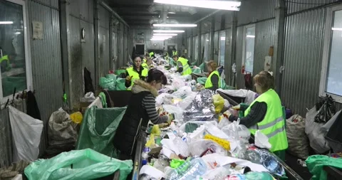 Containers full of solid waste are in the room. Heaps of plastic, cellophane Stock Footage 156078388