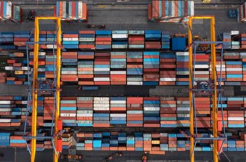 Containers loading and unloading at the seaport. Top view Stock Photos