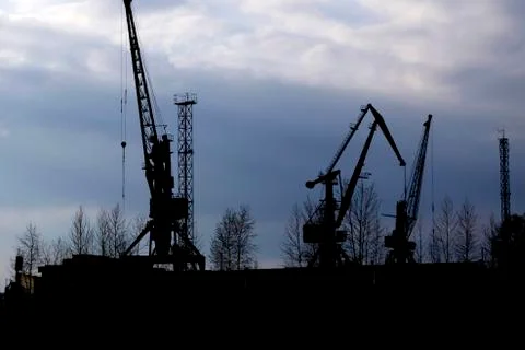 Containers loading by crane in the evening trade port shipping, Shipping and  Stock Photos