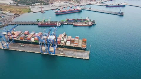Containers loading operations to cargo ship at the container terminal port Stock Footage 254765919