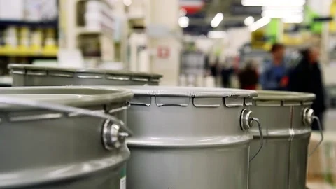 Containers with paint are displayed on the shelf of the store Stock Footage 205554903