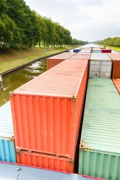 Containers on  ship in river Stock Photos