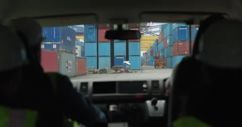 Containers stacked in buzzing port view from car window Stock Footage 319833733
