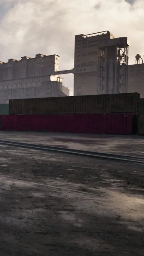 Containers stacked at a shipping yard near a city during late afternoon Stock-Footage 340636780