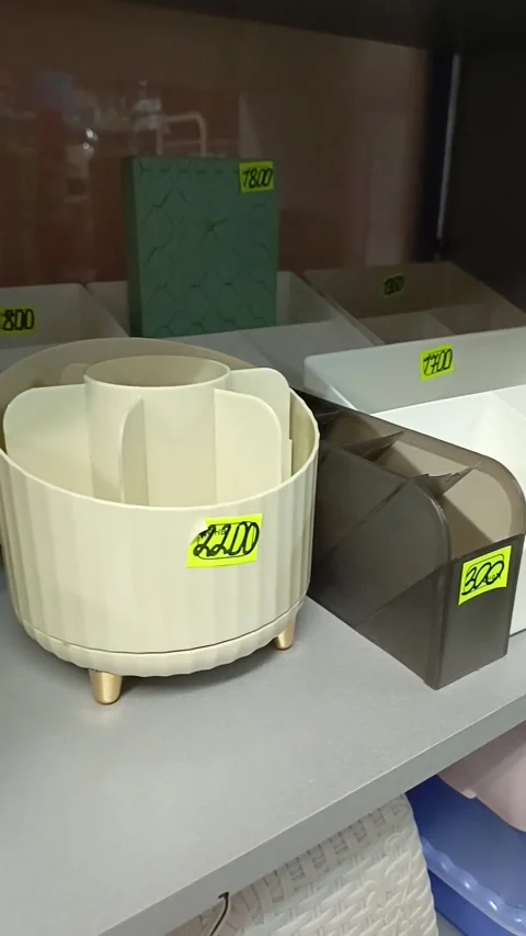 Containers for storing cosmetics on the shelf. Organization of storage in the Stock Footage 319980732