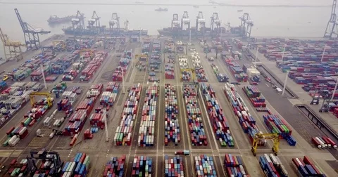 Containers terminal with cargo ship at port Stock Footage