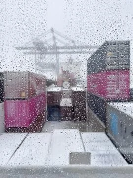 Containers through a creek with raindrops Stock Photos