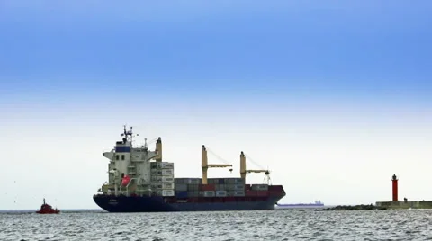 Containerships, the pilot and lighthouse Stock Footage 53187790