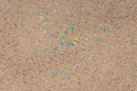 Contamination of environment with microplastics on beach. Close-up Foto stock
