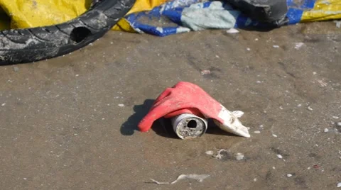 Contamination in marine currents drag garbage to beach. Handheld close up shot Stock Footage 50786937