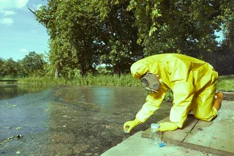 Contamination of surface source of water - technicial collecting samples Stock Photos