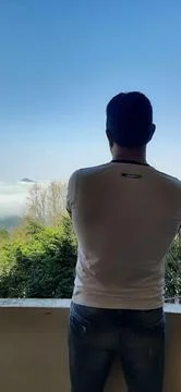 Contemplating the vastness of the clouds Stock Photos