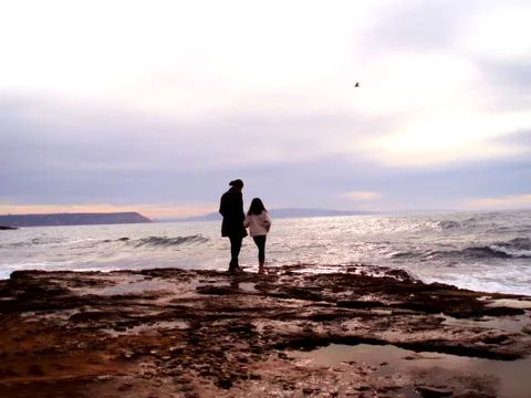 Contemplating the waves 库存照片