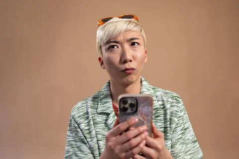 Contemplating While Holding Phone Stock Photos