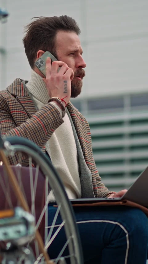 Contemplative businessman sitting outside and thinking about solving problem Stock Footage 256067553