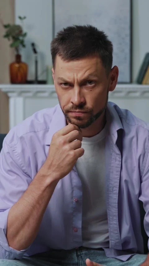 A contemplative man dressed in casual attire is deep in thought and reflection Vídeo Stock 314208523