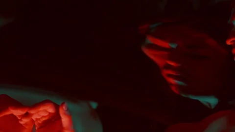 Contemplative Man Looking around in Dark Studio with Distorting Mirror Stock Footage 289868970