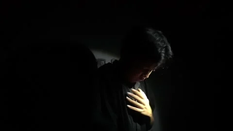 Contemplative Moment in Darkness Stock Footage 313467880