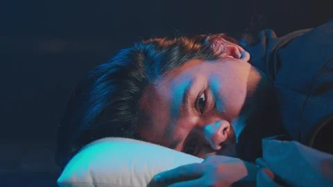 Contemplative Portrait with Dramatic Lighting Stock Footage 296589166