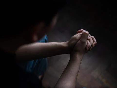 Contemplative reflection individual in dim light emotional moment indoor setting Stock Photos