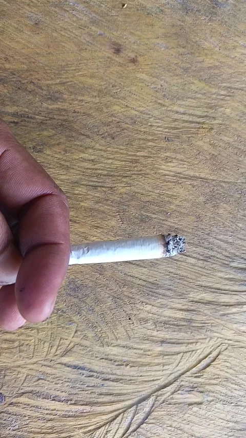 Contemplative Smoke Break: Close Up of Cigarette with Relaxing Bird Sounds Stock Footage 314588325