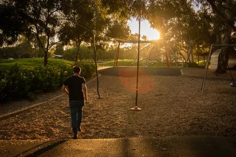 Contemplative Stroll at Dusk Stock Photos