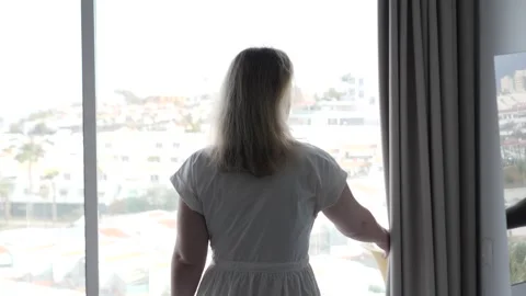 Contemplative Woman Deep in Thought While Looking Out the Window Stock Footage 317019332