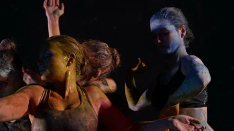 Contemporary art and dance performance, ladies are covered by paints are dancing Stock Footage