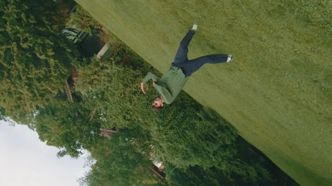 Contemporary Boy Performs Improvised Dance Elements On Sunny Lawn 4k Video Stock Footage 275347717