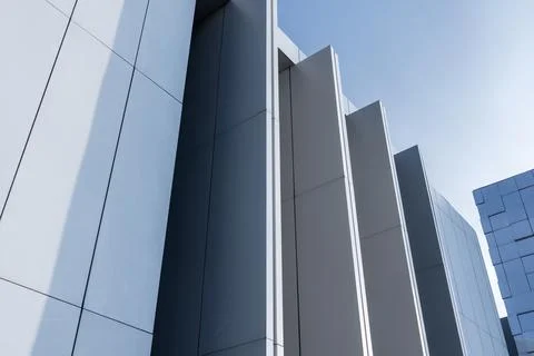 Contemporary building facade featuring vertical geometric panels Stock Photos