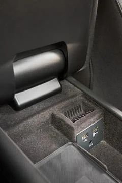 Contemporary car interior element inside of driver seat armrest usb and aux Stock Photos