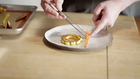 Contemporary chef begins expertly plating a meal Video stock 153334656
